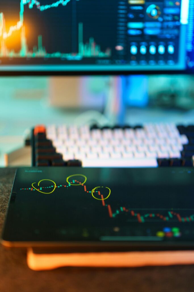 Visual of cryptocurrency trading screens displaying market analysis and candlestick charts.